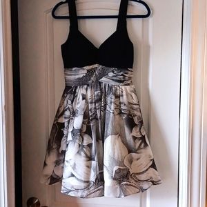 Black/white dress; attached puffy slip under dress. NEVER WORN, but tags removed